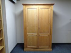 A pine double door wardrobe,