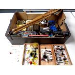 A box of fishing flies in boxes, DVDs relating to fishing, rifle scope, compass, folding stool,