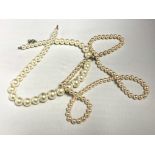 Two faux pearl necklaces