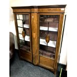 A late 19th century inlaid mahogany double door display cabinet