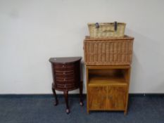 A demi lune jewellery chest together with a mid 20th century walnut double door bedside cabinet and