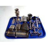 A tray containing assorted plated wares to include hip flasks, knife rests,