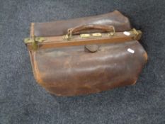 A leather Gladstone bag