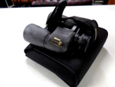A pair of Nikon Action EX 10x50 waterproof binoculars in carry case