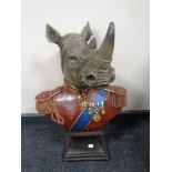 A plastic bust of a rhinoceros in military dress