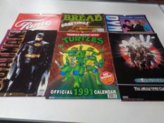 A quantity of vintage film and TV calendars including Ghostbusters 2, Teenage Mutant Ninja Turtles,