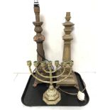 Two reproduction classical style table lamps together with a brass menorah