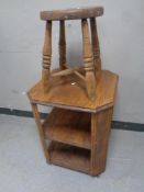 An Edwardian oak octagonal three tier book table together with an antique pine farmhouse stool