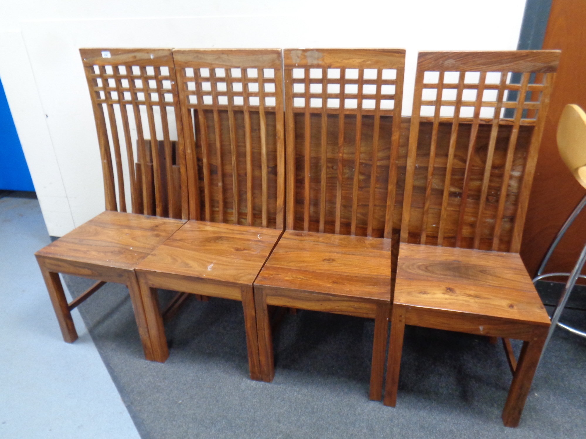 A sheesham wood dining table together with a set of four high back chairs