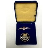 A 9ct gold RAF brooch and a silver brooch