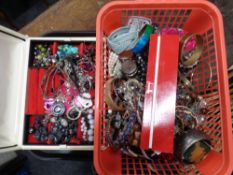 A basket and a jewellery box containing a large quantity of assorted jewellery