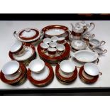 An extensive Surrey China red and white tea and dinner service with gold overlay