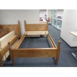 A contemporary pine 4 ft bed frame with mattress slats