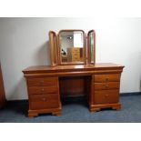 An Olympus Furniture cherry wood knee hole dressing table fitted drawers with triple mirror