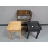 An early 20th century oak stick stand with lift out tray together with two pine stools