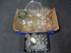 Two boxes containing a quantity of antique and later glassware to include jelly moulds,