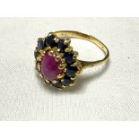 A 9ct gold garnet and ruby ring