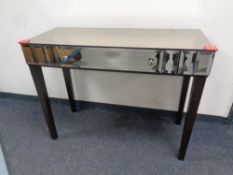 A Marks and Spencer's furniture mirrored console table fitted a drawer,