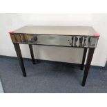 A Marks and Spencer's furniture mirrored console table fitted a drawer,