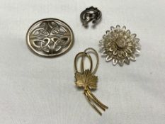 Four silver brooches