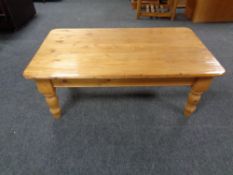 A rectangular pine coffee table,