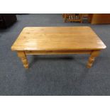 A rectangular pine coffee table,