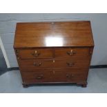 A 19th century mahogany bureau fitted four drawers on bracket feet