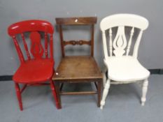 An antique mahogany dining chair together with two further antique painted kitchen chairs