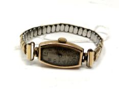 A 9ct gold lady's watch on expansion strap