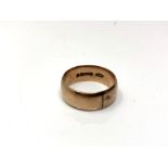 A 9ct gold band ring,