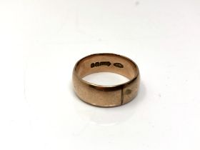 A 9ct gold band ring,