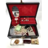 A box of costume jewellery, five 50 pence pieces, cuff links, necklaces, brooches,