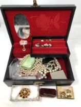 A box of costume jewellery, five 50 pence pieces, cuff links, necklaces, brooches,