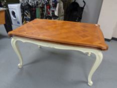 A French draw leaf table on painted cabriole legs
