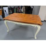 A French draw leaf table on painted cabriole legs