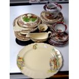 A tray of 23 pieces of Royal Staffordshire rural scenes dinner china designed by Clarice Cliff