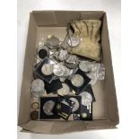 A collection of coins to include commemorative crowns, six pence pieces,