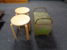 A green loom storage stool together with two contemporary circular stools