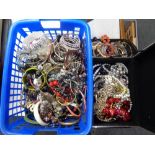 A basket and a jewellery box containing a large quantity of assorted jewellery