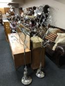 A pair of contemporary metal floor lamps with crystal detail in the form of trees