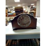 An early 20th century oak Enfield mantel clock
