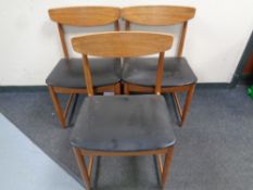 A set of three mid 20th century Danish teak dining chairs