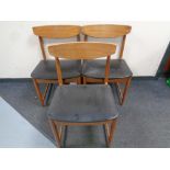 A set of three mid 20th century Danish teak dining chairs