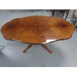 An Italianate shaped pedestal coffee table together with a further coffee table