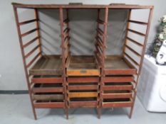 A set of cast iron industrial racking fitted with fifteen pine trays, height 164 cm,