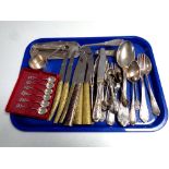 A tray containing assorted plated cutlery, cased teaspoons,