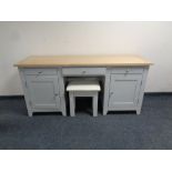 A contemporary oak topped twin pedestal dressing table on painted base fitted cupboards and drawers