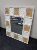 A rectangular bevelled mirror in painted frame