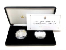 A Jubilee Mint Queen Elizabeth II Commemorative Coin Pair, boxed with certificate of authenticity.