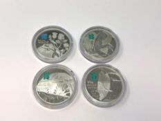 Four London 2012 Olympics silver proof commemorative crowns.